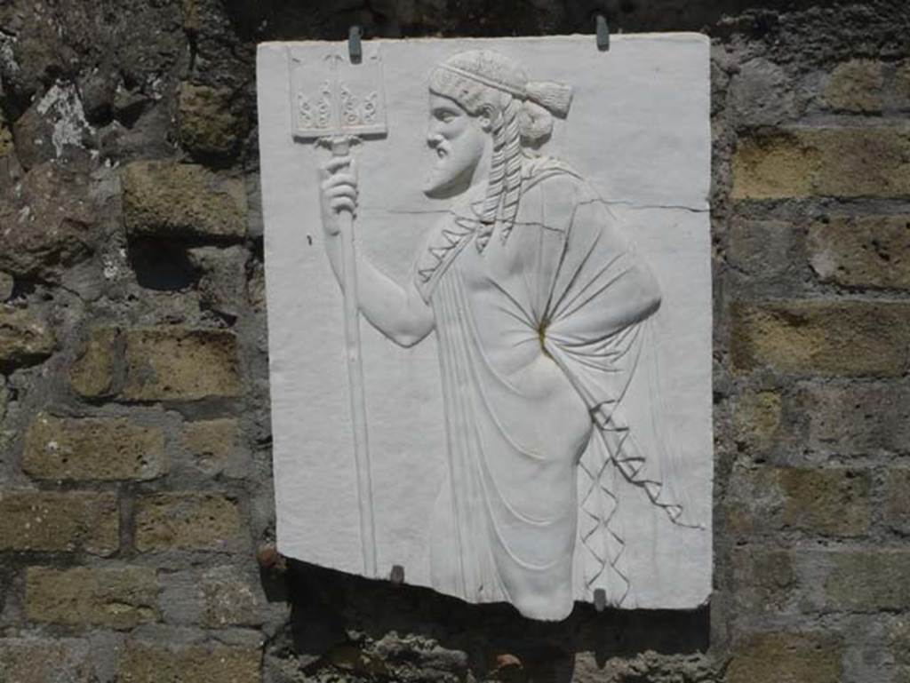 Herculaneum, August 2013. Sacred Area terrace, the shrine of Four Gods. Reproduction relief of Neptune. Photo courtesy of Buzz Ferebee.